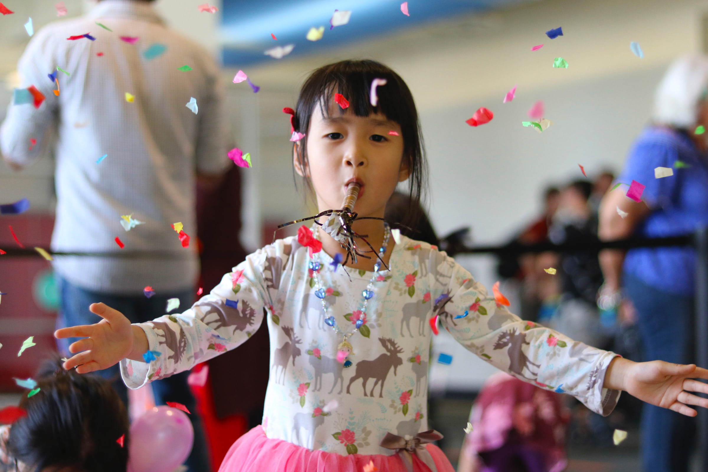 Child celebrating with confetti