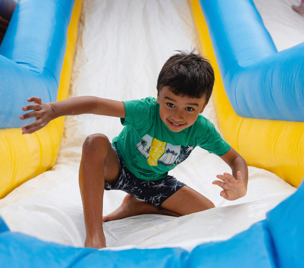 Child playing on tube slide