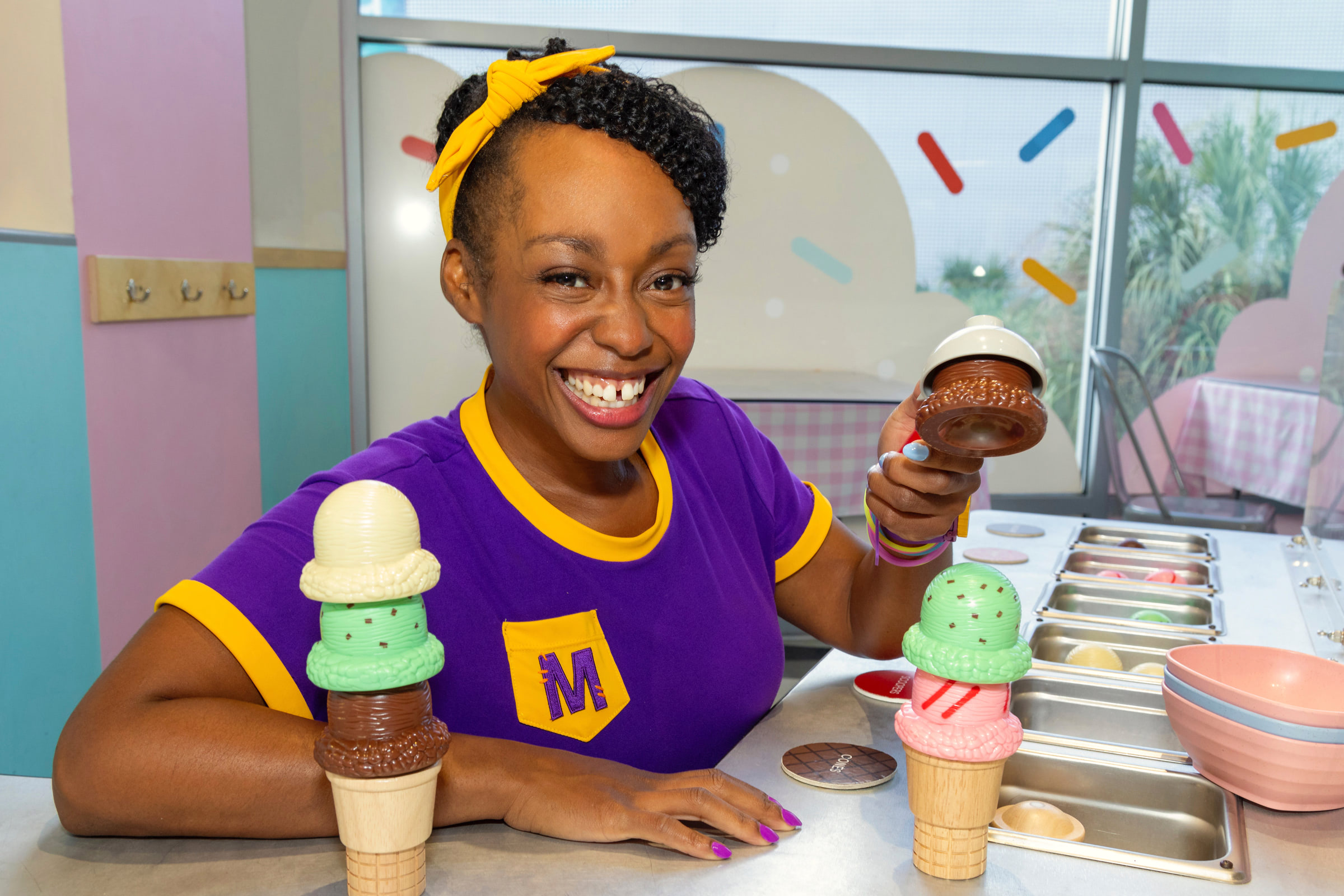 Woman smiling while making pretend ice cream at GCM