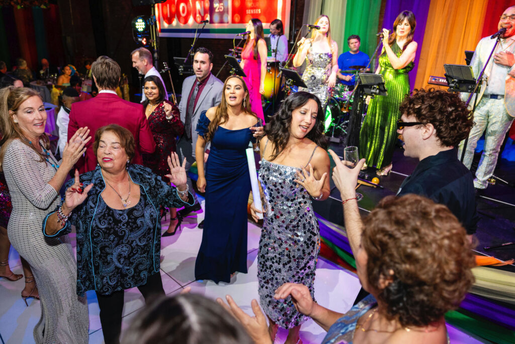 People dancing at a music show during a gala