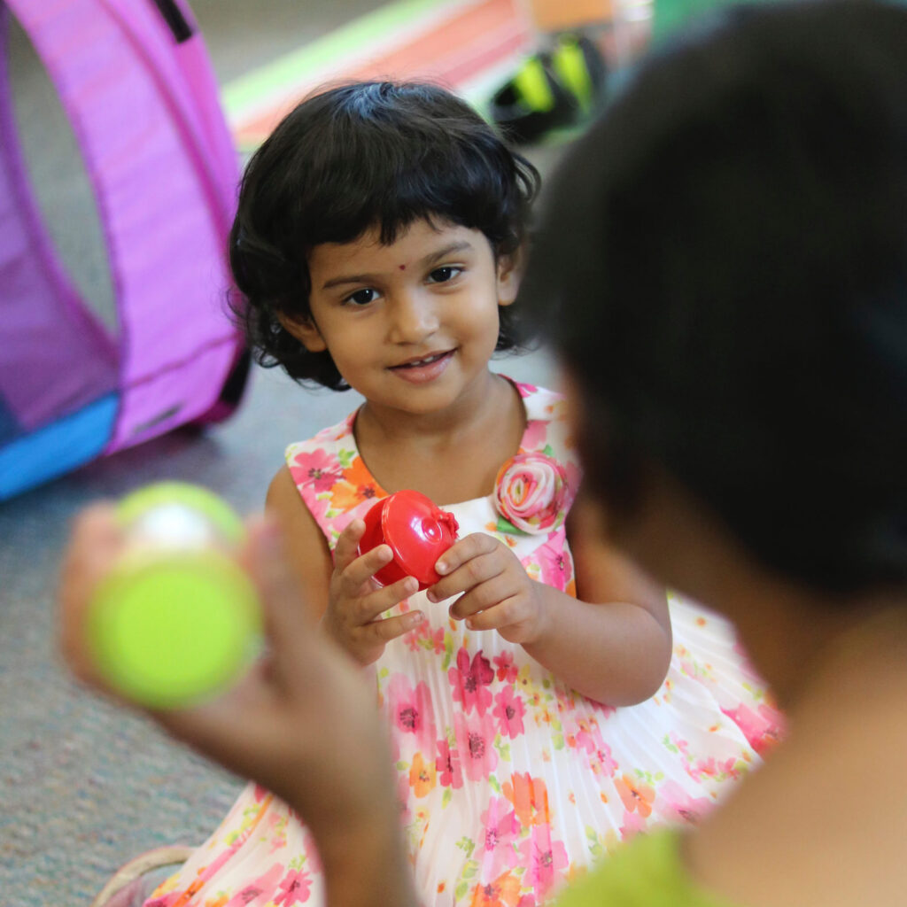 a small child playing with toys