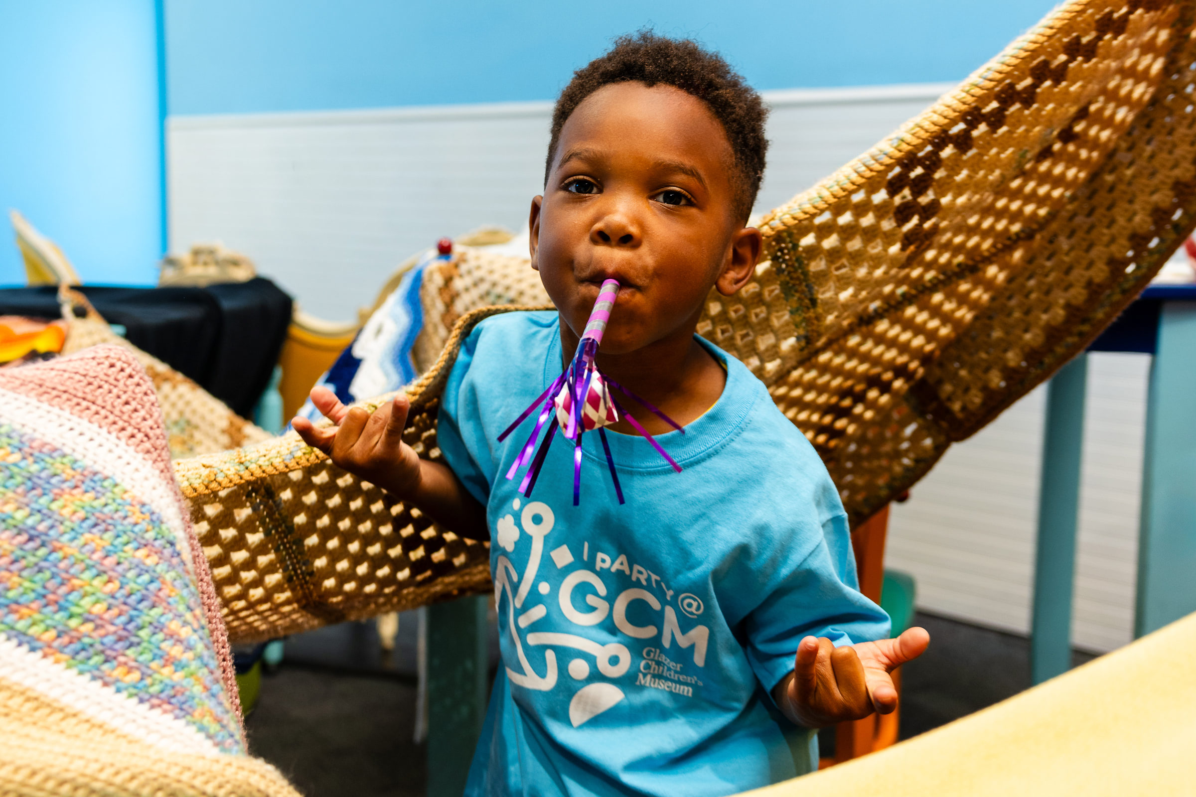 A boy wearing a shirt saying 