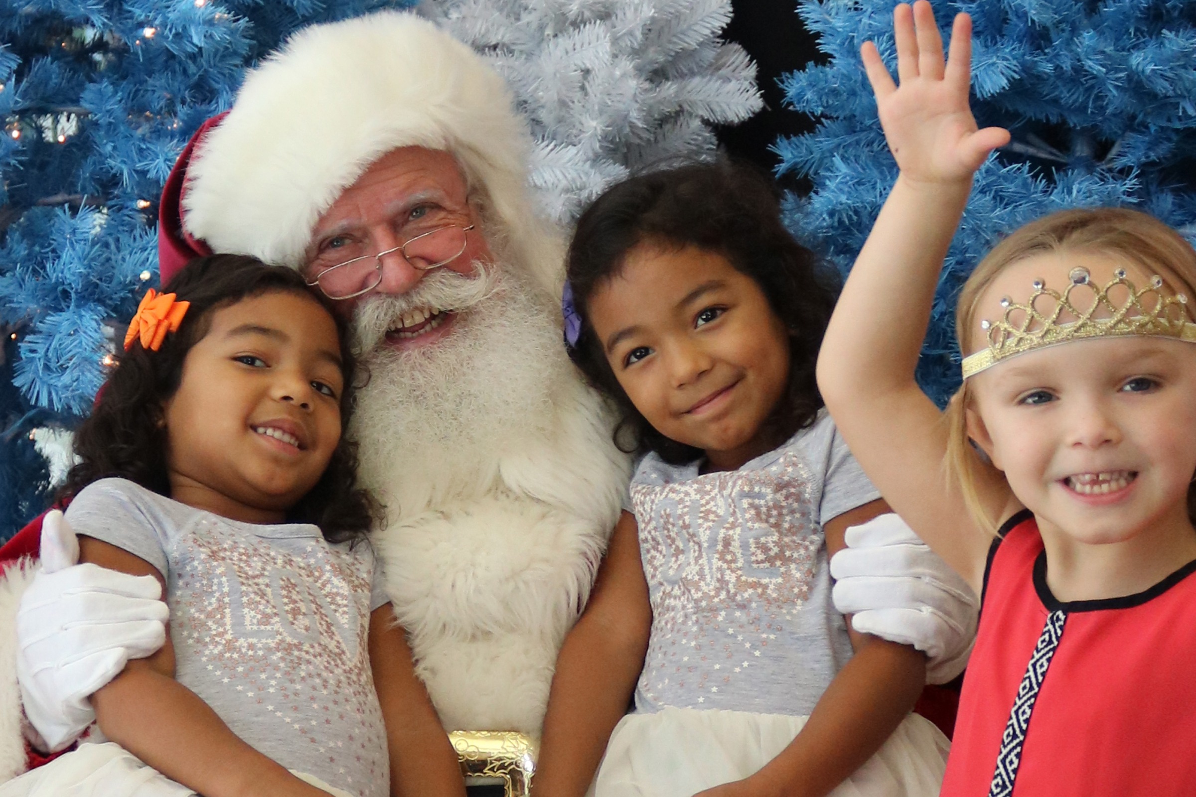 Santa Clause and three little girls